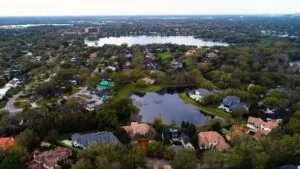 Aerial view of tree-filled residential area near lakes, showing one of the top neighborhoods in Orlando with strong home value