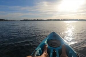 Kayak view on Lake Conway Chain showing calm freshwater and open waterfront scenery