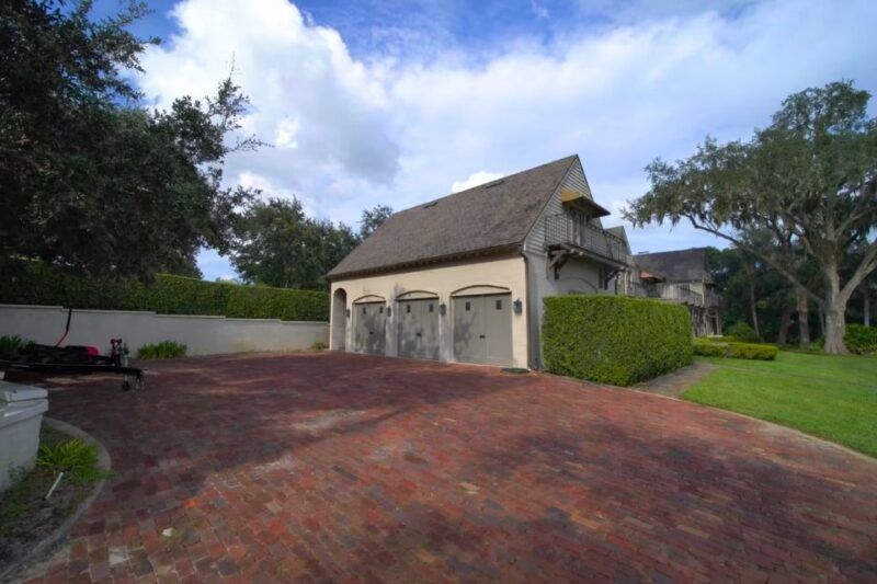 Luxury residential property near Lake Conway featuring a spacious driveway and well-maintained landscaping